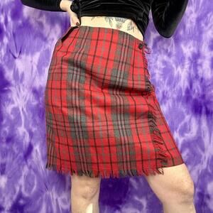 Red and black plaid wrap skirt with fringe detail
